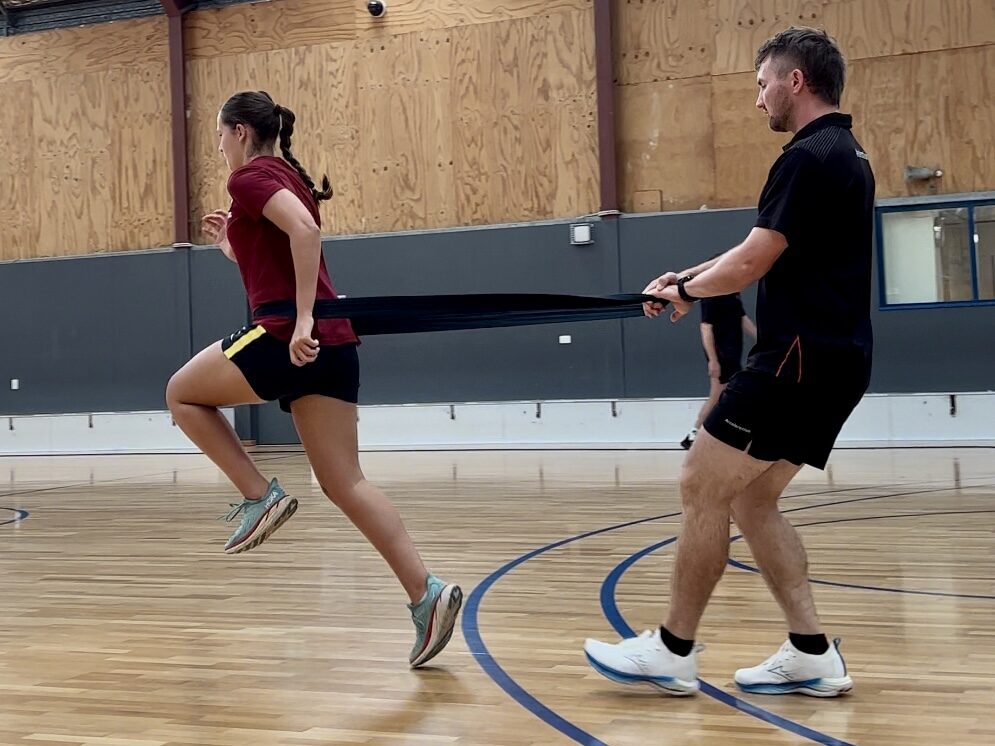Athlete improving running form with a Gold Coast private running coach.